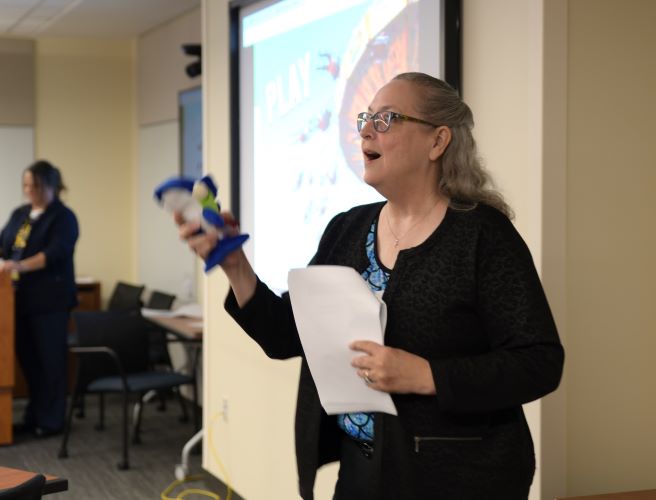 Lynn McCain throwing Pete as she teaches on "Play"